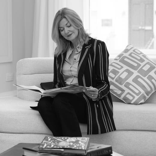 Woman sitting on couch in waiting room of medical clinic